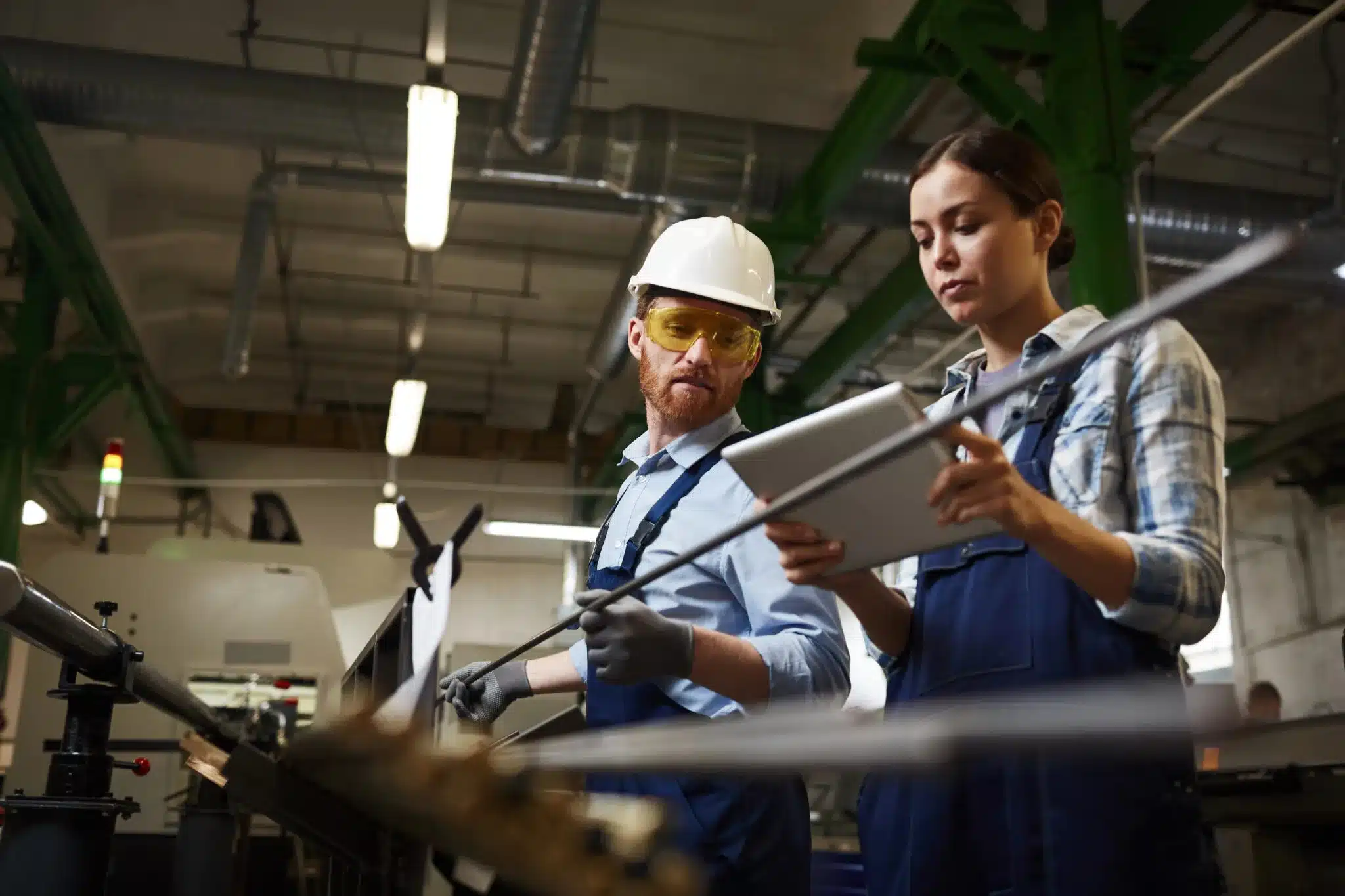 Engineer performing quality checks to improve manufacturing process yield and reliability